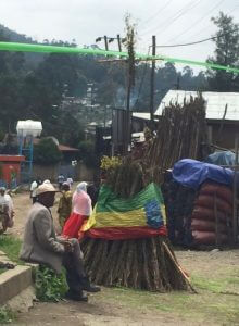 A small Meskal bonfire at Kebena, dropped in the Ethiopian flag, with a cross on the top.