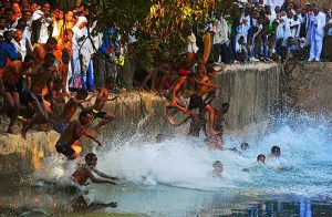 Worshippers jump into the Fasilides baths