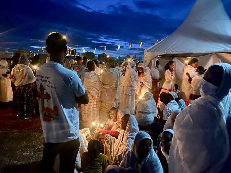 Worshippers holding tapers on Jan Meda for Timkat