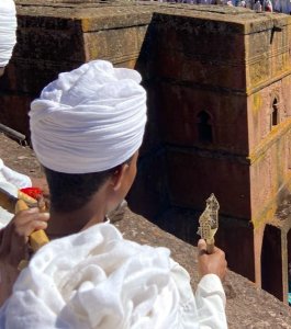 Deacon using sistrum in Lalibela